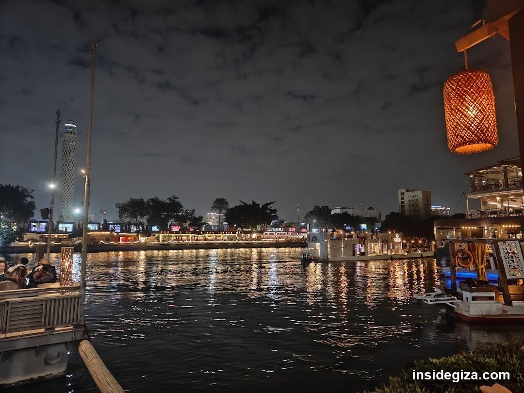 Night River View with Boats and Buildings