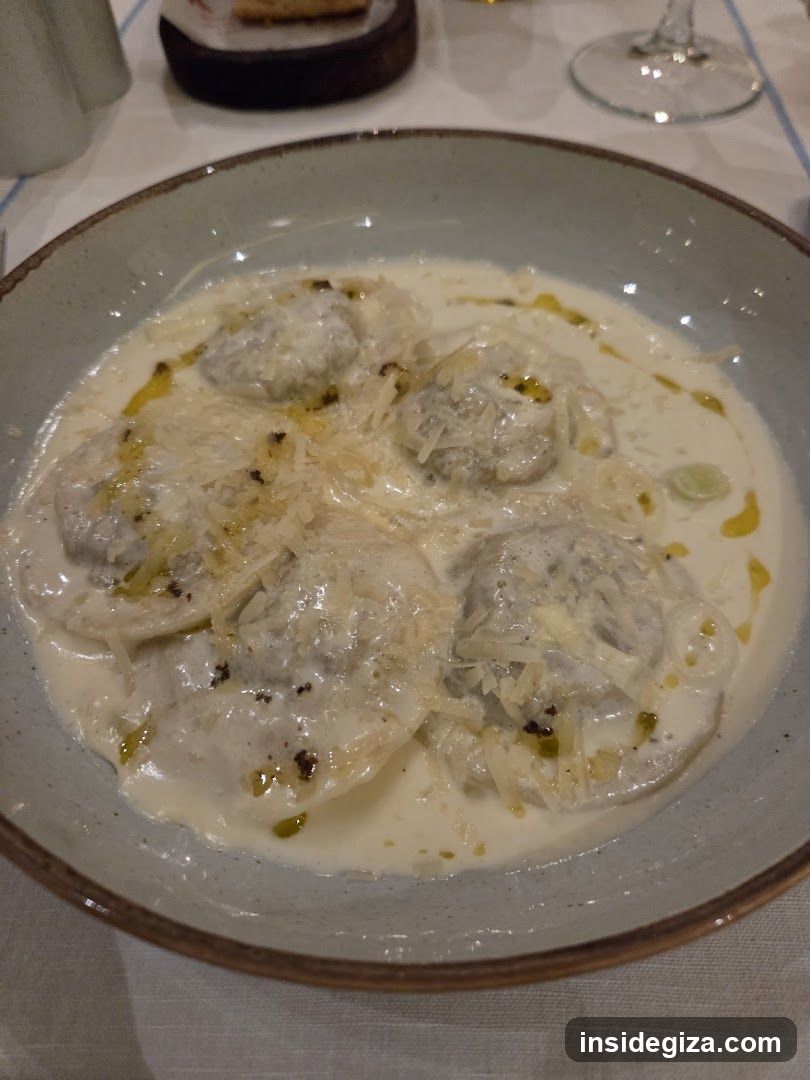 Dish with Creamy Sauce and Cheese Topping