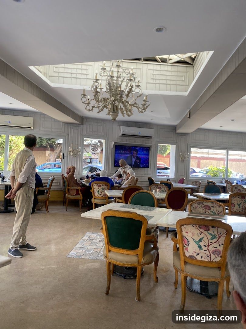 Restaurant Interior with Chandelier and TV