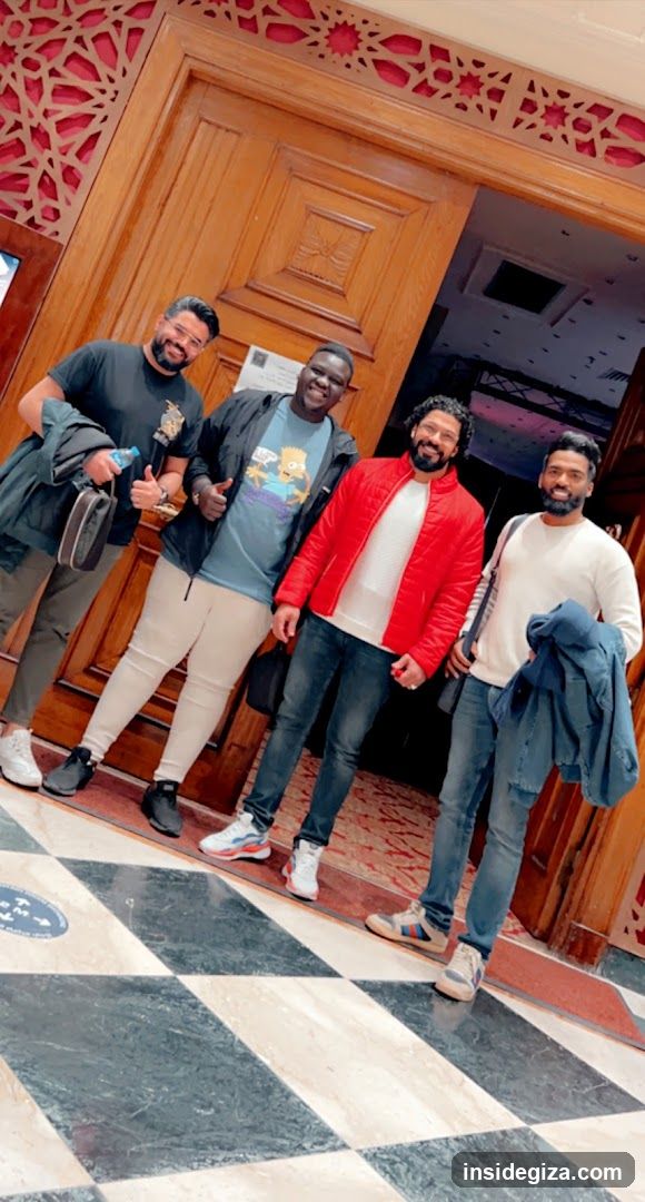 Group of men in a lobby