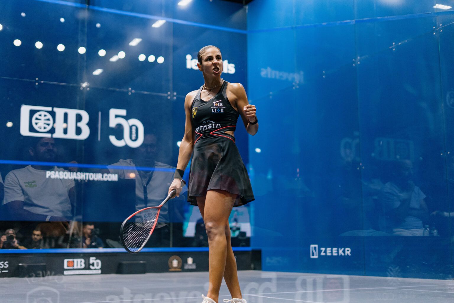 Hania El Hammamy competing at the CIB Egyptian Open on the Giza glass court