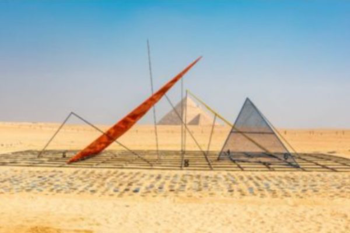 Forever Is Now installation photographed against the Giza pyramids
