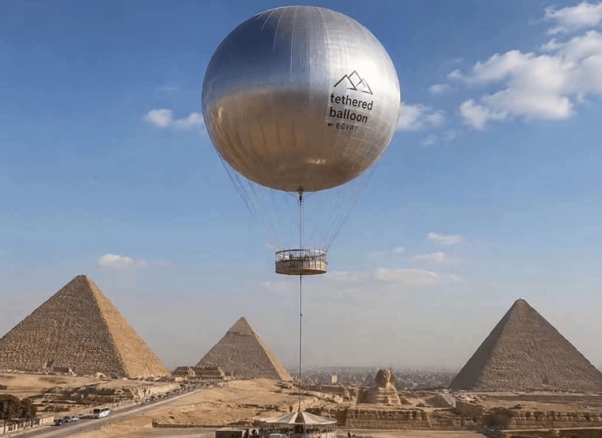 Silver tethered balloon envelope beside the Giza Pyramids plateau