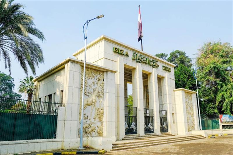 Restored heritage structures within the redeveloped Giza Zoo including the Eiffel Bridge and Royal Hall